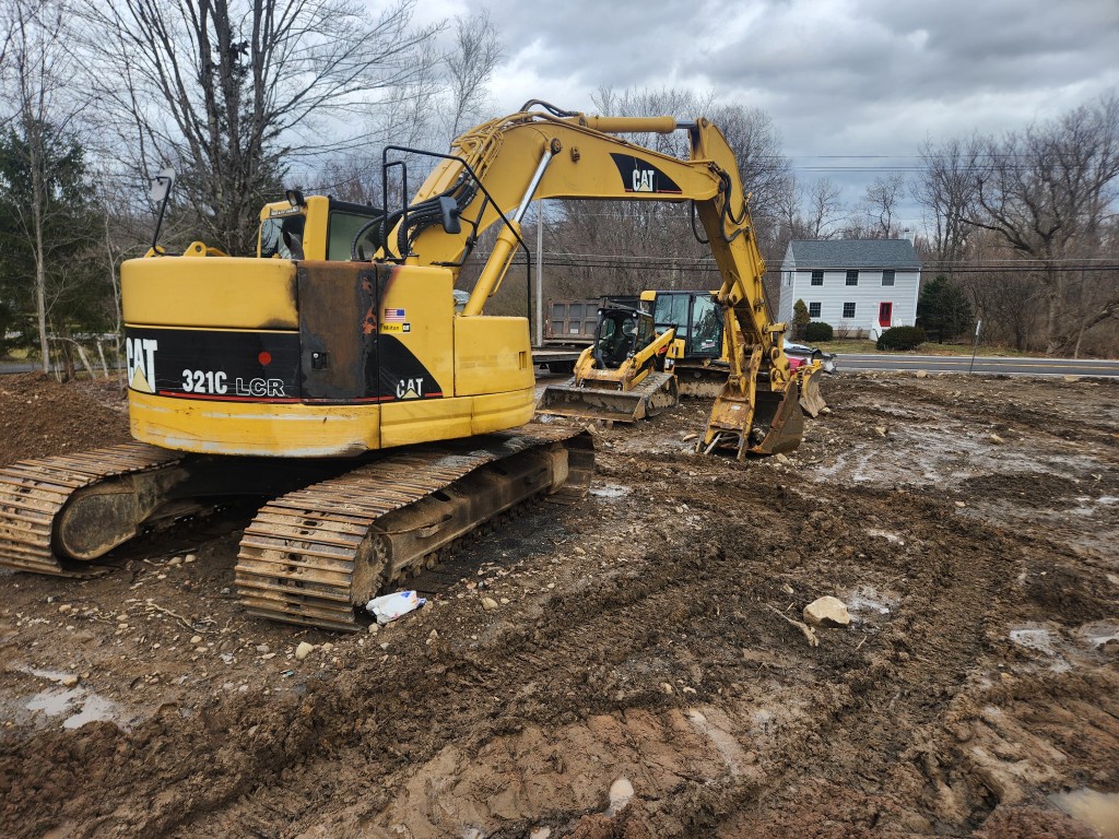 CAT excavators on muddy job site